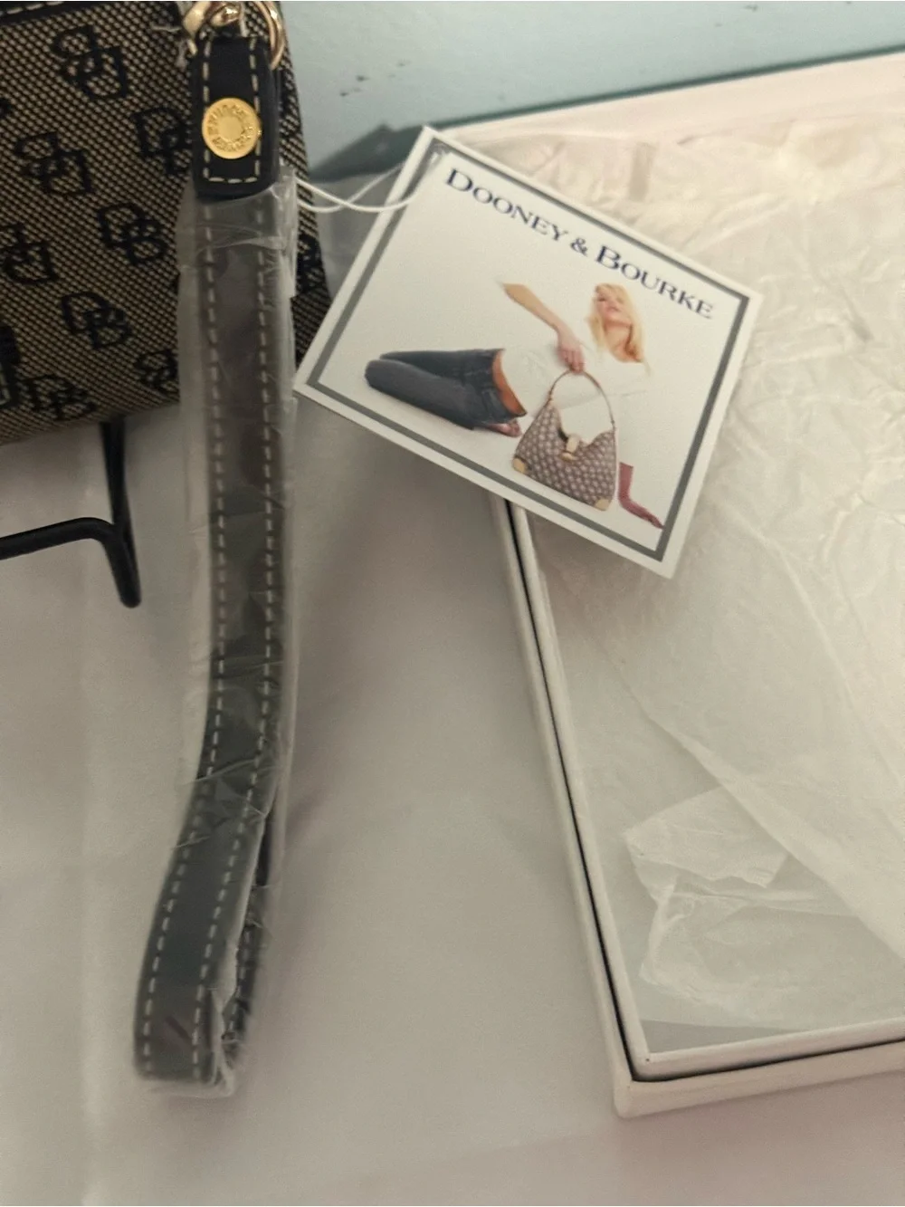 Dooney and Bourke NWT Medium logo wristlet. Comes in a box!